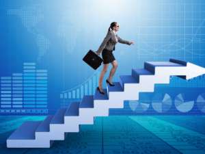 A businesswoman holding a briefcase climbing a staircase, symbolizing career progression and growth.