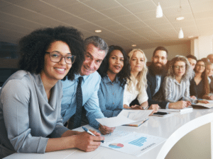 Group of diverse business professionals gathered around a table.